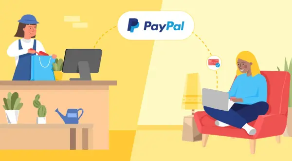 Geschäftsinhaber packt Ware in Einkaufstasche, während Kunde online mit PayPal bezahlt. Informiert über PayPal Business Account Gebühren.