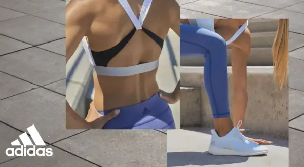 Kobieta w sportowym stroju, w tym bielizna adidas, ćwiczy na zewnątrz.