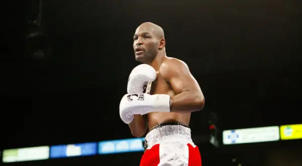 Bernard Hopkins training in the ring, focused and ready. His white gloves are a blur of motion as he prepares for his next fight.