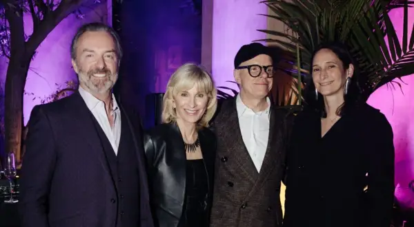 Four individuals pose at an event for the Serpentine Americas Foundation.
