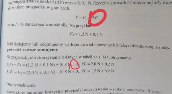 Fragment tekstu z fizyki z zaznaczonym symbolem ΔF i równaniami.