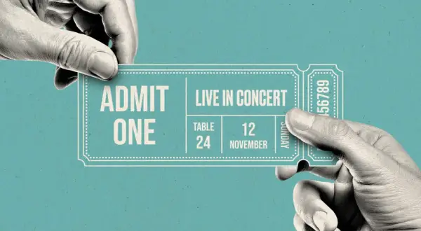 Hands exchange a concert ticket. A resale ticket means someone is selling their ticket to another person, often at a different price.