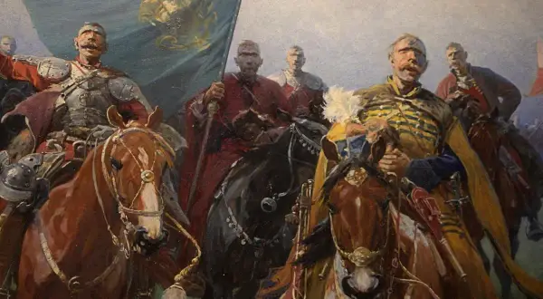 Józef Brandt obrazy: husaria na koniach, z chorągwią i w zbrojach, gotowa do walki. Dynamiczna scena historyczna.