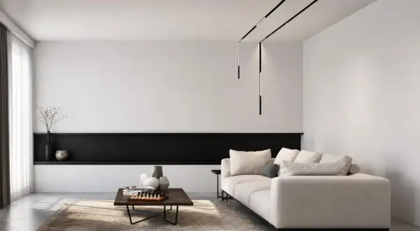 Nowoczesne oświetlenie do salonu aranżacje: minimalistyczny salon z beżową sofą, czarną półką i designerskimi lampami wiszącymi.