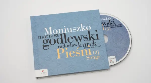 Płyta CD z nagraniem "Pieśni" Moniuszki w wykonaniu Mariusza Godlewskiego i Radosława Kurka. Prząśniczka tekst na okładce.