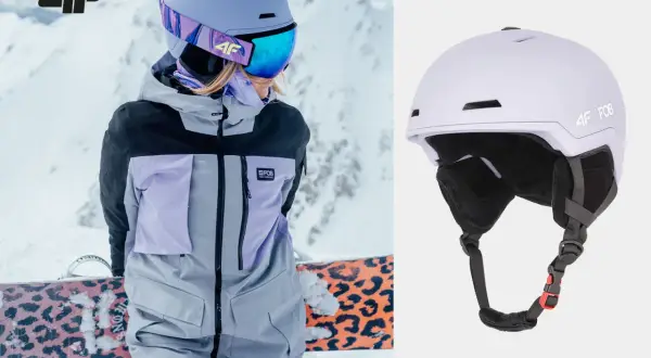 Męski kask narciarski 4F w kolorze liliowym, idealny na stok. Widoczny na zdjęciu z narciarką w kurtce 4F.