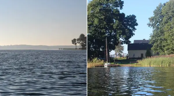 Spokojne jezioro Urszulewskie z łódką przy pomoście i domkiem w tle.