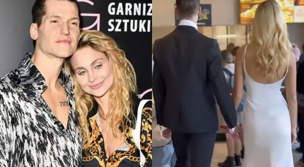 Jacek Jeschke z partnerką, w eleganckim stroju i sukni, trzymają się za ręce.