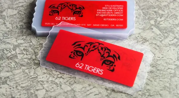 Bold red business cards with tiger eye graphics and "62 Tigers" text. Great business cards ideas for a fierce brand.