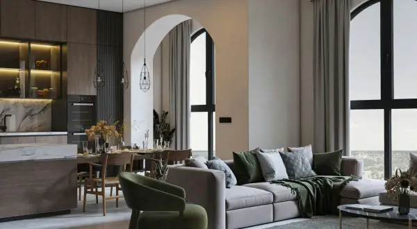 Soggiorno e cucina open space con tavolo da pranzo e divano, in un elegante stile essenziale.