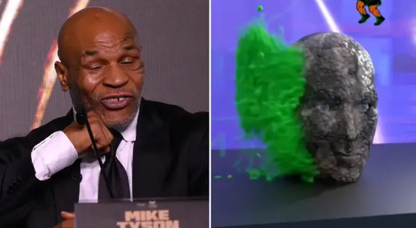 Mike Tyson's legendary punch force visualized as a stone head explodes with green energy.