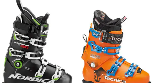 Dwa buty narciarskie: czarny Nordica Dobermann GP 130 i pomarańczowy Tecnica Cochise Pro 130.