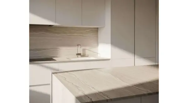 Cuisine moderne avec îlot central. La position des prises de courant est discrète, intégrée au design épuré.