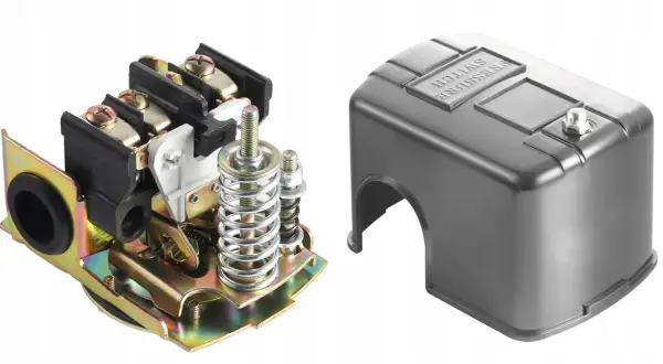 Mechanizm presostatu z elementami sprężynowymi i zaciskami, obok metalowa osłona z napisem "PRESSURE SWITCH".