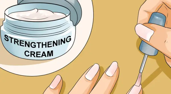 Crema rinforzante per unghie e applicazione di smalto trasparente per far crescere le unghie sane e forti.