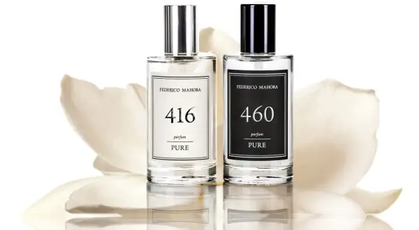 Dwa eleganckie flakony z polskimi perfumami Federico Mahora, 416 i 460, na tle delikatnych płatków kwiatów.