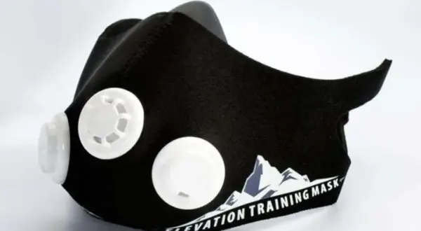 Black training mask with white valves, designed to enhance workout performance. Discover the training mask benefits for your fitness journey.