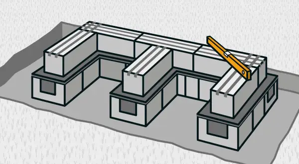 Bygga grill av sten: en U-formad struktur av grå block med en vattenpass på toppen.