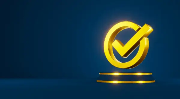 Złoty symbol zaznaczenia na ciemnoniebieskim tle, symbolizujący gwarancję rozruchową i pewność zakupu.