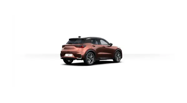 Brązowy Lexus LBX z czarnym dachem, widok z tyłu. Poznaj jego kompaktowe lexus lbx wymiary, idealne do miasta.