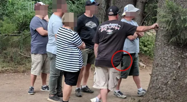 Undercover cops at festivals blend in with the crowd. One officer's concealed firearm is visible in a red circle.
