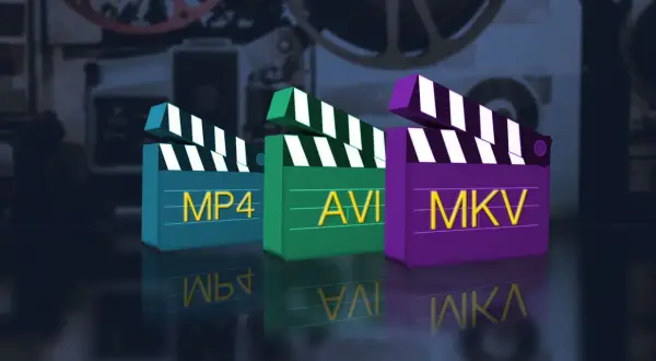 Three clapperboards labeled MP4, AVI, and MKV stand in a row, reflecting on a dark surface.