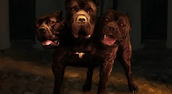 Un chien à trois têtes, aux yeux rouges et aux gueules ouvertes, garde une entrée sombre.