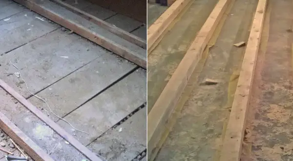 Drewniane belki na starej podłodze, być może z resztkami eternitu. Remont trwa.