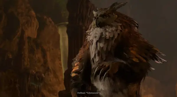 Potężny sowodźwiedź z Baldur's Gate 3, z piórami i pazurami, siedzi w jaskini.
