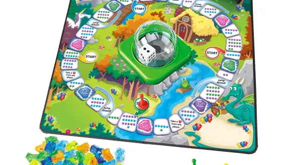 Tablero de juego infantil con dragón, unicornio y gemas de colores.