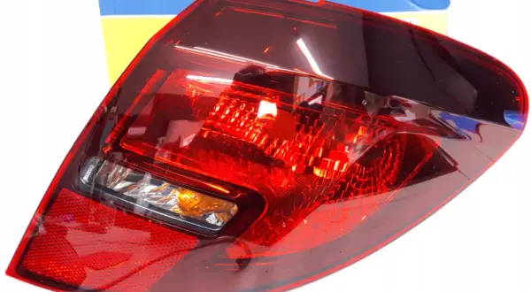 Tylna lampa zespolona do Opel Meriva B. Czerwona, z pomarańczowym kierunkowskazem. W zestawie z pudełkiem.