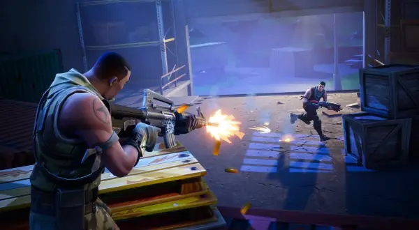 Dwóch graczy w grze battle royale, jeden strzela z karabinu, drugi biegnie.