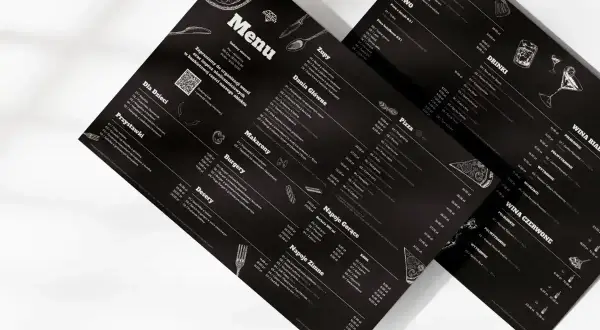 Menu z czarnym tłem, prezentujące ofertę a la carte. Widoczne sekcje: Zupy, Dania Główne, Makaron, Burgery, Desery, Napoje Gorące, Napoje Zimne, Pizza, Piwo, Drink, Wina.