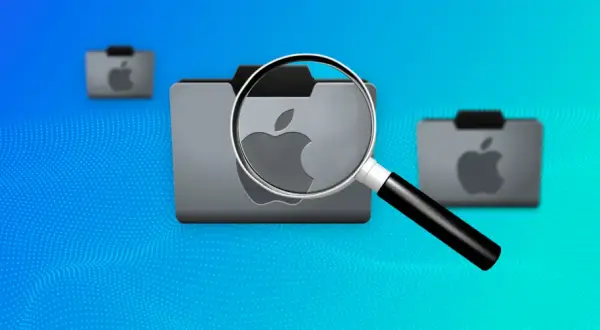 Lupa powiększa ikonę folderu z logo Apple, symbolizując funkcję finder w systemie macOS.