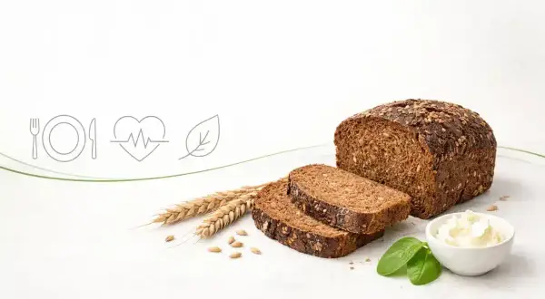 Chleb razowy z ziarnami, kłosy i symbol serca z pulsem. Czy chleb razowy jest zdrowy? Tak, to doskonały wybór dla zdrowia!