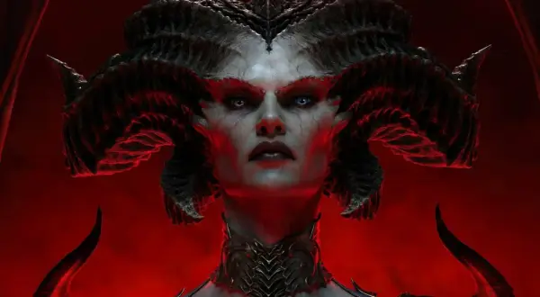 Lilith, z rogami i demonicznym obliczem, zapowiada nowy sezon Diablo 4. Czerwone tło podkreśla jej mroczną aurę.