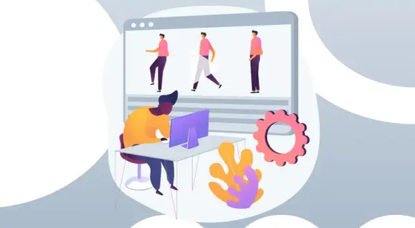 Tworzenie animacji do **explainer video**. Mężczyzna pracuje przy komputerze, tworząc ruchome postacie na ekranie.