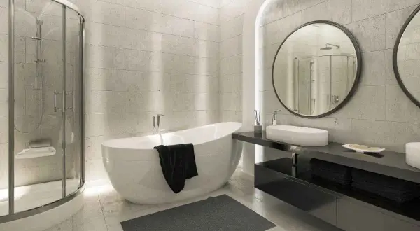 Un moderno bagno cieco con vasca freestanding, doccia a nicchia e doppio lavabo. L'ambiente è elegante e minimalista.
