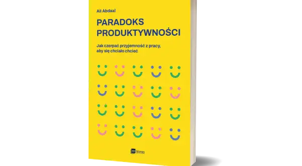 Okładka książki "Paradoks Produktywności" Ali Abdaala. Żółte tło z rzędami uśmiechniętych buziek.
