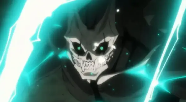 Ein Kaiju mit Totenkopf-Gesicht und leuchtend grünen Augen, umgeben von blauen Energien. Ein Vorgeschmack auf Kaiju No. 8 Staffel 2.