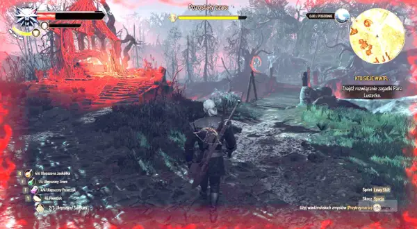 Geralt w rynsztunku szkoły żmii przemierza mroczny las. Czerwone światło otacza ruiny.