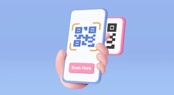 Dłoń trzyma smartfon z kodem QR i przyciskiem "Scan Here". Dowiedz się, jak zeskanować kod QR.