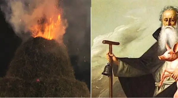 Falò e un dipinto di Sant'Antonio Abate con un maialino, che evoca la leggenda del santo protettore degli animali.