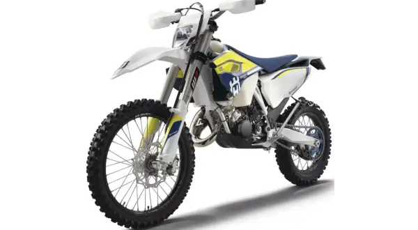 Motocykl terenowy Husqvarna 125 Enduro w kolorze białym z niebieskimi i żółtymi akcentami.