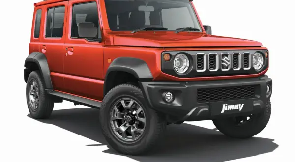 Pomarańczowy Suzuki Jimny 5-drzwiowy, gotowy na przygody. Sprawdź jego cenę i możliwości terenowe!