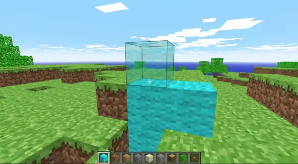 Gra w **minecraft w przeglądarce**. Gracz buduje wieżę z niebieskich bloków, na której stawia szklaną ścianę.
