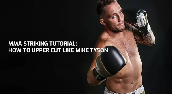 MMA fighter demonstrates a powerful uppercut to the body, channeling the legendary Mike Tyson.
