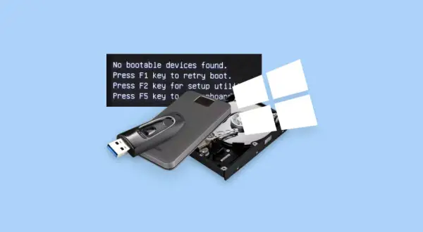 Komputer nie widzi dysku, wyświetlając komunikat "inaccessible boot device". Pendrive i dysk twardy leżą obok.