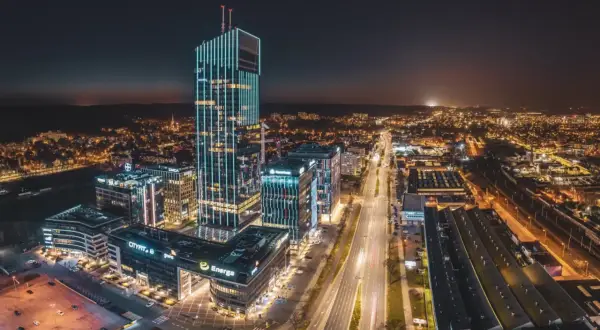 Olivia Star, imponująca **wysokość** wieżowca, rozświetla nocne miasto.