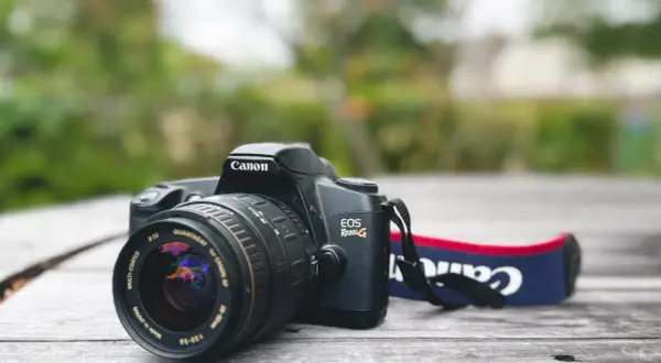 Canon EOS Rebel G film camera with a Quantaray 28-90mm lens, a classic choice for the best Canon 35mm film camera experience.